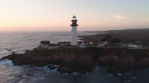 Pigeon Point Lighthouse on California Coast at Sunset with Ocean Waves