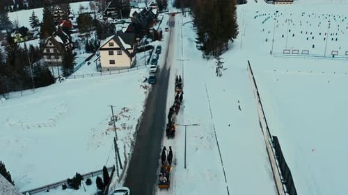 Touristic Drone Aerial View of Horse Sleigh Ride in Winter Snow Polish Mountains