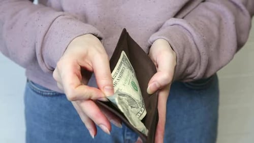 Empty wallet with one dollar only, Economy crisis