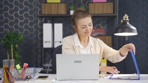 Woman Working at Desk on Laptop Computer
