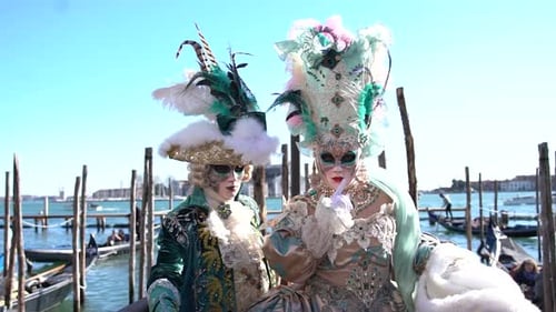 Venice Carnival: Costumed Performers on Sunny Waterfront