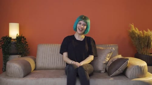 The young woman who talks to herself and laughs.