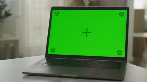Laptop Green Screen Mockup on Table