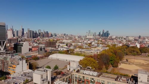 Aerial View of a Tree Lined Street in an Urban Area of Brooklyn New York City Cars are Driving on