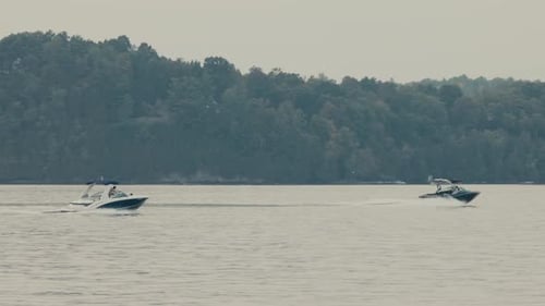 Motorboats Cruising In The Lake At Sunrise. - wide, slow motion
