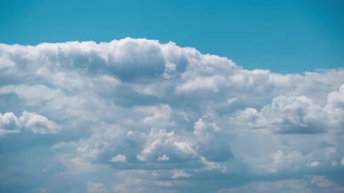 White Clouds Floating in a Blue Sky Time-Lapse
