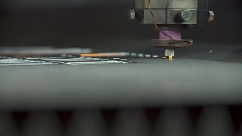 Laser Cutting Metal Sheet with Bright Sparkles