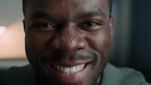 Close Up of Black Man Acting Cheerfully at Camera