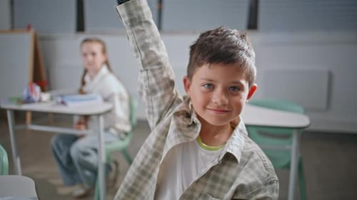 Portrait Smart Pupil Studying at Elementary School Positive Boy Raising Hand