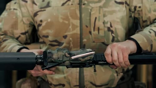 Close Up at a Professional Shooting Range on Range in a Tree Stand a Trainer Gives Instructions on