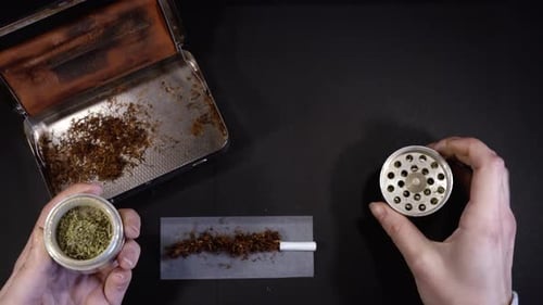 Preparing Cigarette with Rolling Paper and Herb Grinder