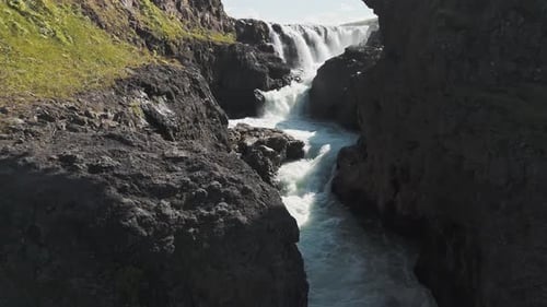 Drone View Of A Deep Iceland Canyon With A Mountain River Below