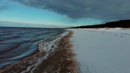 Aerial View at the Baltic Sea, Winter Season Landscape by the Sea in Sunny Day. Snowy Beach at Winte