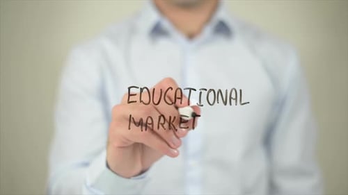 Writing Educational Marketing on Clear Surface
