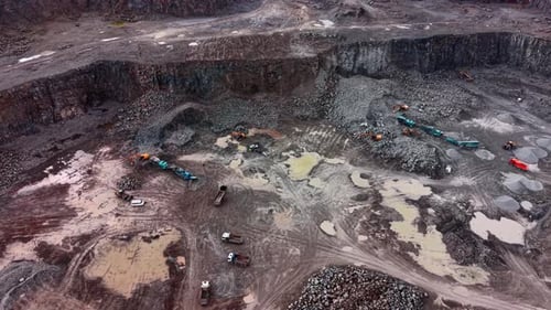 Granite extraction in a quarry with heavy machinery at work