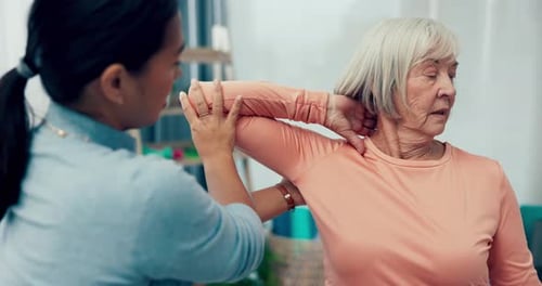 Woman Receives Gentle Arm and Shoulder Physical Therapy