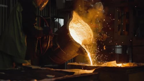 Foundry Workers Pouring Molten Metal