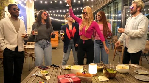 Friends Celebrate at Outdoor Nighttime Birthday Party