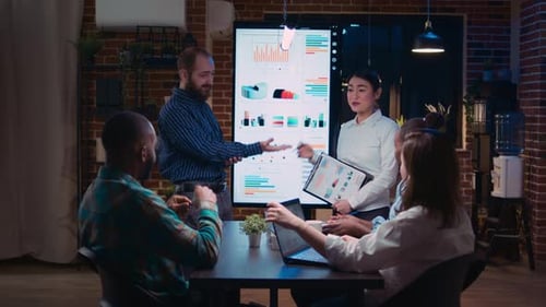 Business Team Analyzing Data in Corporate Meeting