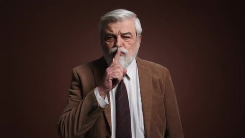 Mature Man Gestures for Silence