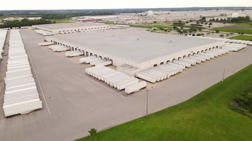 Semi truck trailers manufacturing plant in aerial view of USA warehouse