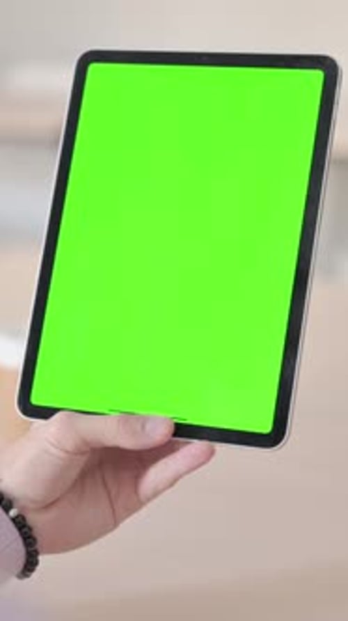 Rear View of Man Using Tablet with Green Chroma Screen, Vertical Video