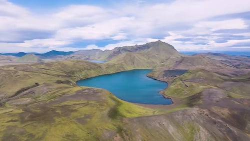 Aerial view of serene lake and mountains, Iceland.