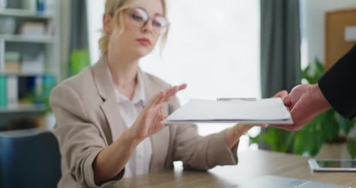 Employee Gives Documents to Businesswoman