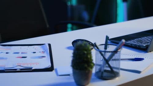 Office Desk Filled with Productivity Items in Empty Home