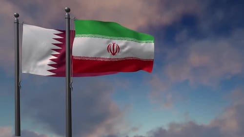 Waving Flags of Qatar and Iran Against a Cloudy Sky