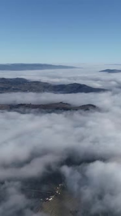 Vertical Video of Landscape Fog Mountain Aerial View