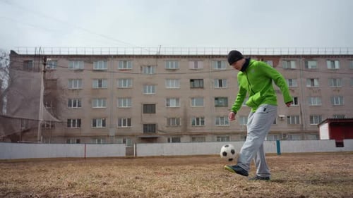 Urban Juggling Practice Individual Practicing Ball Control Outdoors During Daytime Man in Vibrant