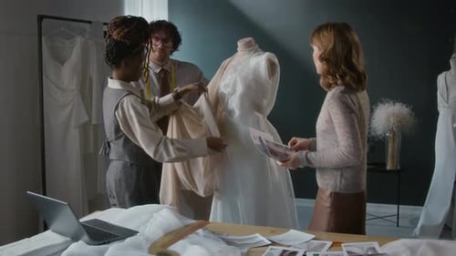 Dressmakers Collaborate on Fashion Design in Studio