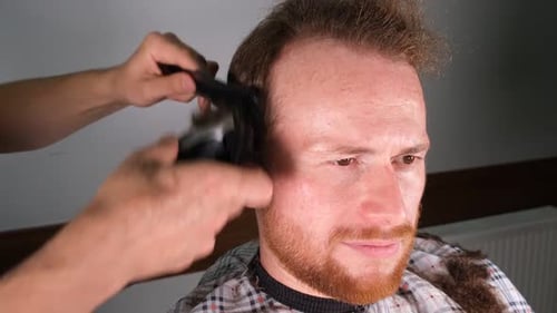 Man Getting Haircut Indoors