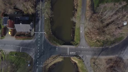 Drone shot of beautiful dutch landscape with canal and roads.