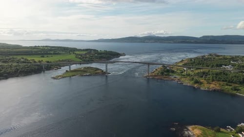 A Bridge Spans Fast-moving Tidal Currents as Waters Surge Through the Narrow Strait at