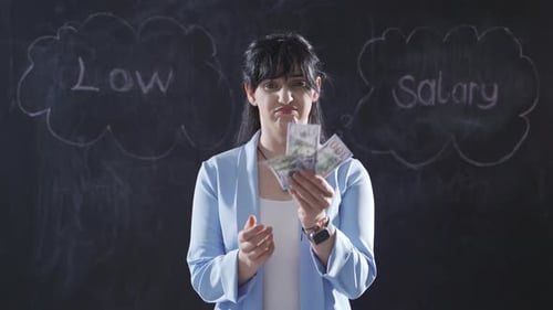Woman Disapproves Low Salary in Front of Blackboard