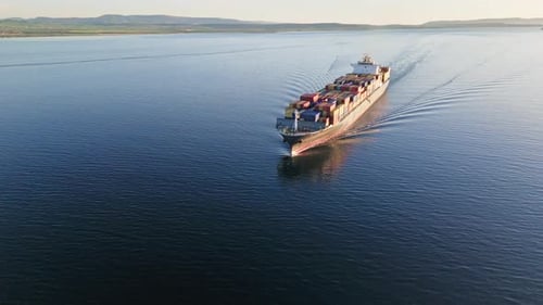 Container Ship Sailing on the Blue Ocean