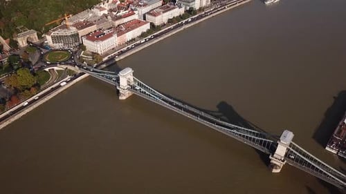 Aerial footage of Budapest, Hungary over the Danube river on a summer's day