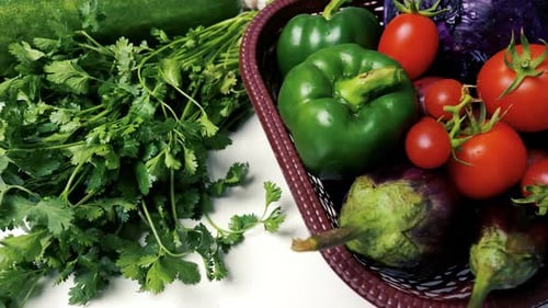 Fresh Vegetables and Herbs in a Basket