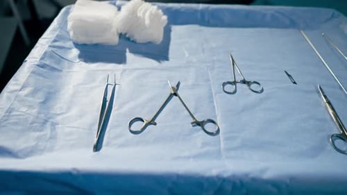 Surgical Instruments Ready on Blue Cloth in Hospital