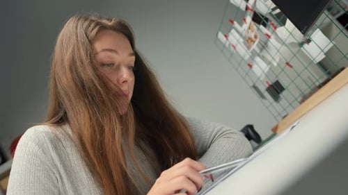 Close-up: woman lawyer office worker proofreading a contract before signing