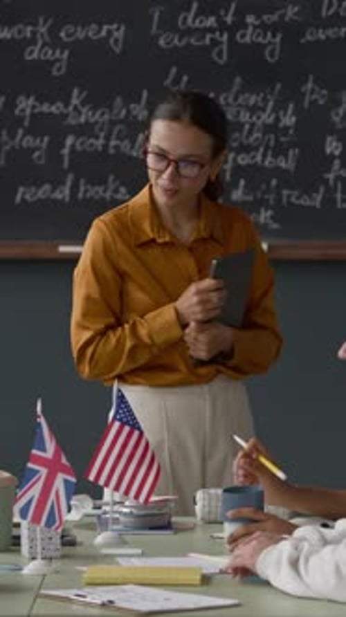Teacher Giving English Lesson in Classroom