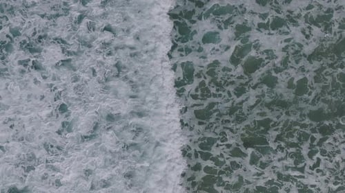 Crashing Foamy Waves Onto Sea Coast In Razo Beach During Summertime In Galicia, Spain. Aerial Drone