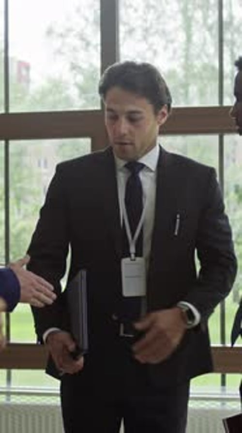 Confident Businessman Networking at Corporate Conference