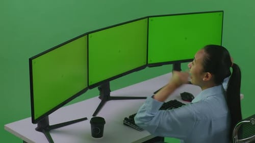 Happy Asian Woman Celebrating And Dancing With Mock Up Multiple Computer Monitor In Green Screen