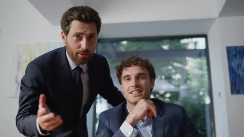 Office Men Talking Virtual Meeting Using Computer Online at Coworking Pov View