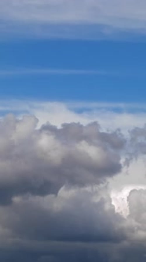Dramatic Sky with Drifting Clouds on Sunny Day