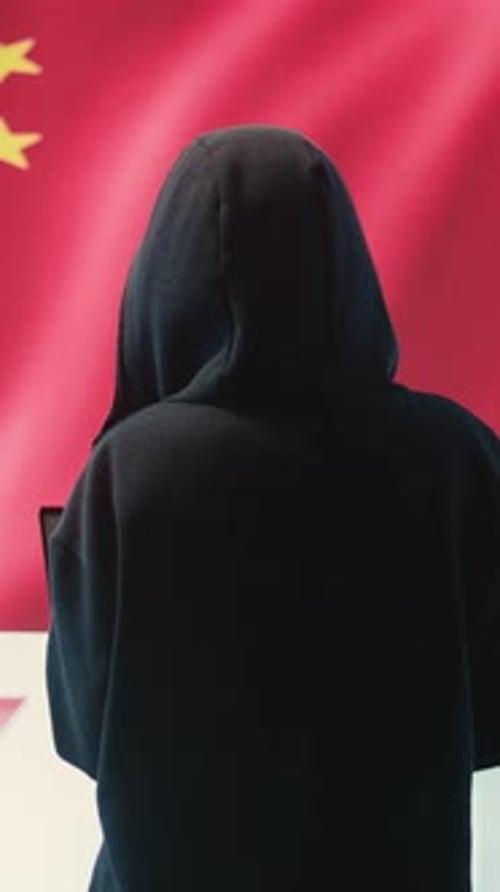 Vertical Video Terrorist Person in a Chinese Cyber Security Room Hacking National Systems