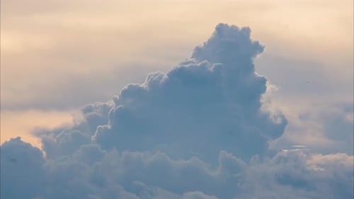 Aerial view of beautiful sky with clouds and sun on a summer day.